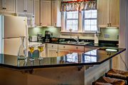 The fully equipped kitchen in the Guest Cottage